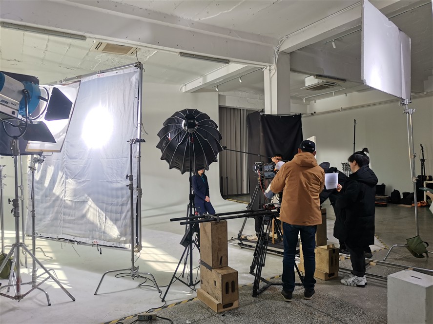 Studio lighting and camera setup during a corporate shoot in China.